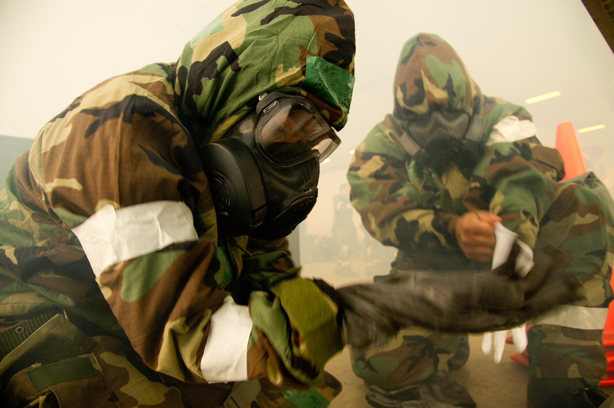 Tech Sgt. Lucila Dickinson, 452d Logistics Readiness Squadron, dons her mission
operating protective posture gear, during an ATSO rodeo. (U.S. Air Force photo by Staff Sgt. Matthew Smith)