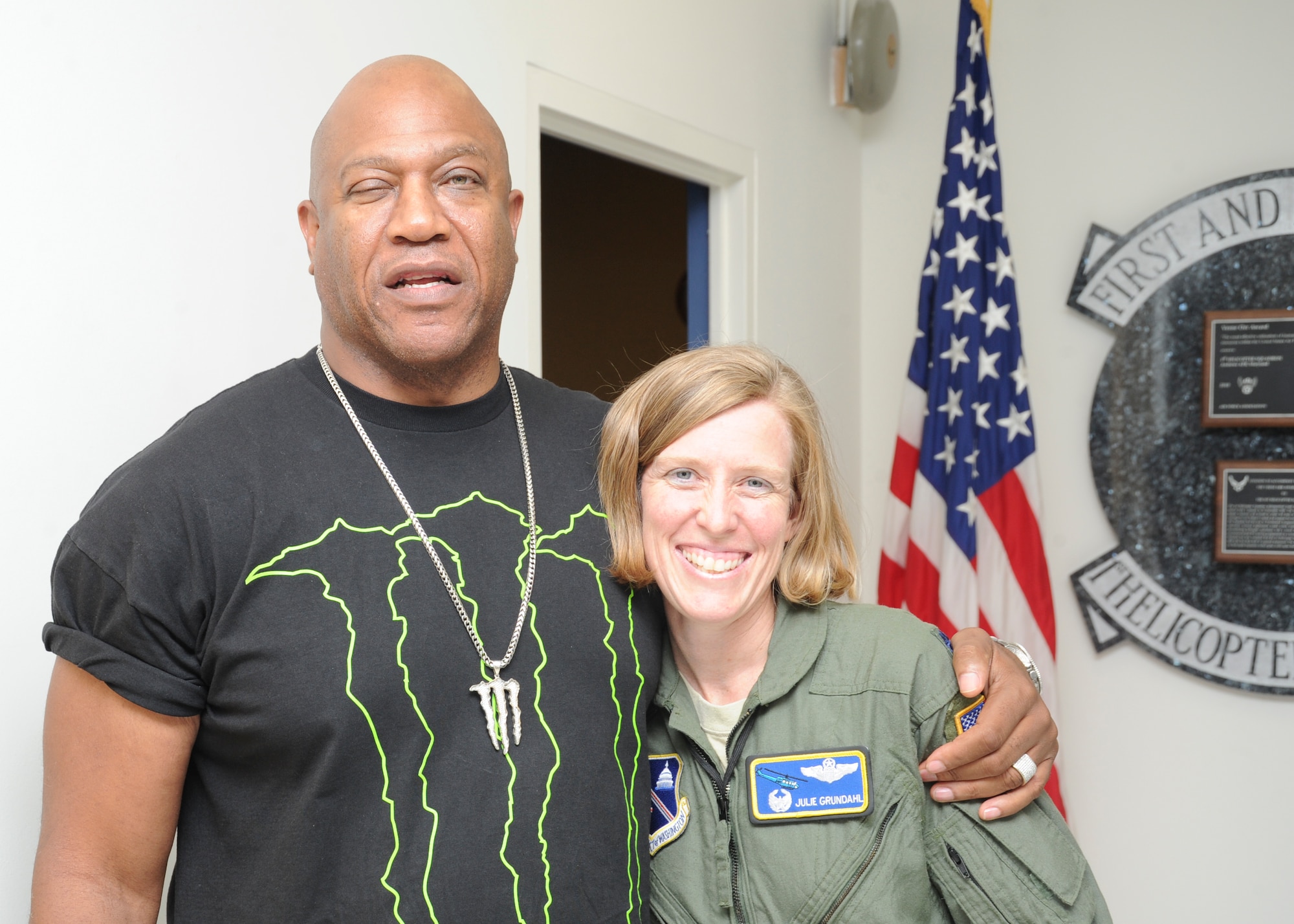 Tommy "Tiny" Lister, a character actor and professional wrestler widely known for his role as neighborhood bully Deebo in the “Friday” movie trilogy, visited Joint Base Andrews’ 1st Helicopter Squadron on July 12. The 1 HS flew Lister to Dover Air Force Base, Del., to visit the Air Force Mortuary Affairs Office, USO and troops there. Lister and Lt. Col. Julie Grundahl, 1HS commander, smile for the camera during the actors visit here. (U.S. Air Force photo by Airman Aaron Stout)