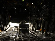 919th Special Operations Wing loadmasters attempt to lower the load bay door on an MC-130E Combat Talon I during an aerial drop mission from Duke Field, Fla.  The 919th are the only wing in the Air Force still flying the Talon I.  Over the next two years, the Talons will be phased out of the 919th as it moves to an Aviation Foreign Internal Defense mission.  (U.S. Air Force photo/Tech. Sgt. Samuel King Jr.)