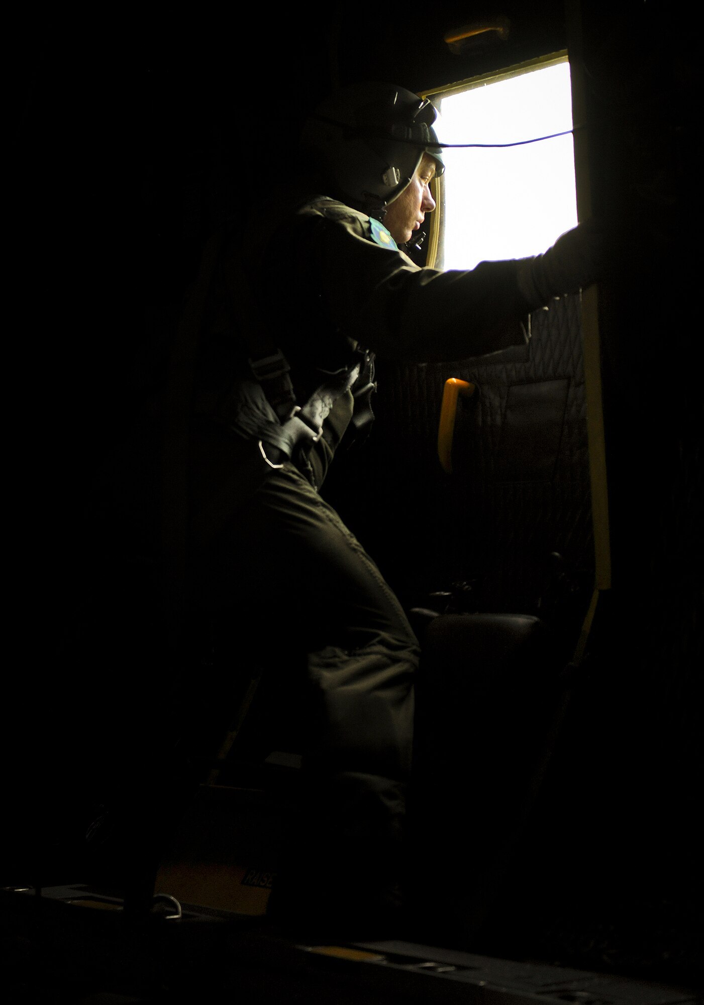 Staff Sgt. Donald McNaron, a loadmaster with the 919th Special Operations Wing, watches the engines begin to start before an MC-130E Combat Talon I mission at Duke Field, Fla. The 919th are the only wing in the Air Force still flying the Talon I.  Over the next two years, the Talons will be phased out of the 919th as it moves to an Aviation Foreign Internal Defense mission.  (U.S. Air Force photo/Tech. Sgt. Samuel King Jr.)