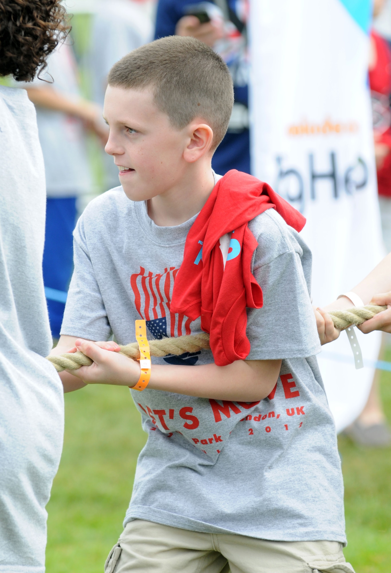 LONDON – Ethen Duvall, 10, son of Tech. Sergeants Rich and Jacelyn Duvall, RAF Lakenheath, plays tug-of-war with British and fellow American children at the United States Ambassador to the United Kingdom’s residence during a fitness-themed event July 27, 2012. The festivities were part of first lady Michelle Obama’s “Let’s Move!” campaign to combat childhood obesity. The first lady and several Olympic athletes took turns playing games with the kids. (U.S. Air Force photo/Staff Sgt. Austin M. May)
