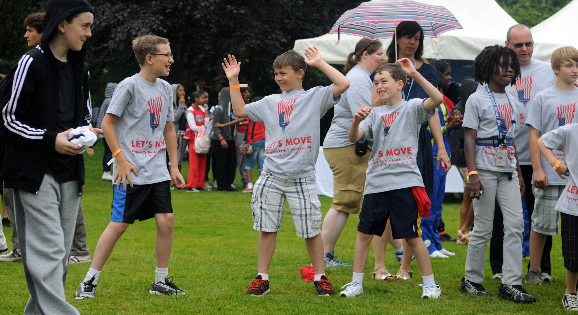 LONDON – Children from the United States and the United Kingdom dance to music by British pop band The Wanted at the United States Ambassador to the United Kingdom’s residence during a fitness-themed event July 27, 2012. Musical performances from singer Katy B. and Mark Ronson, as well as the University of Florida marching band, kept the crowd in motion and enthralled spectators. (U.S. Air Force photo/Staff Sgt. Austin M. May)