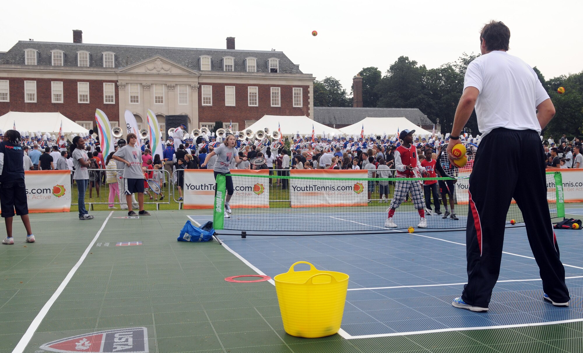 LONDON – Children from the United States and the United Kingdom take turns playing tennis with members of the USA Olympic tennis team at the United States Ambassador to the United Kingdom’s residence during a fitness-themed event July 27, 2012. The festivities were part of first lady Michelle Obama’s “Let’s Move!” campaign to combat childhood obesity. The first lady and several Olympic athletes took turns playing games with the kids. (U.S. Air Force photo/Staff Sgt. Austin M. May)