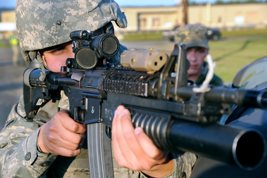 U.S. Air Force Airman 1st Class Patrick Shirley, 354th Security Forces Squadron security forces specialist, takes aim with an M-4 carbine during an operational readiness exercise July 26, 2012, Eielson Air Force Base, Alaska. The exercise tests a wing’s capability to respond to various scenarios. (U.S. Air Force photo/Staff Sgt. Jim Araos)