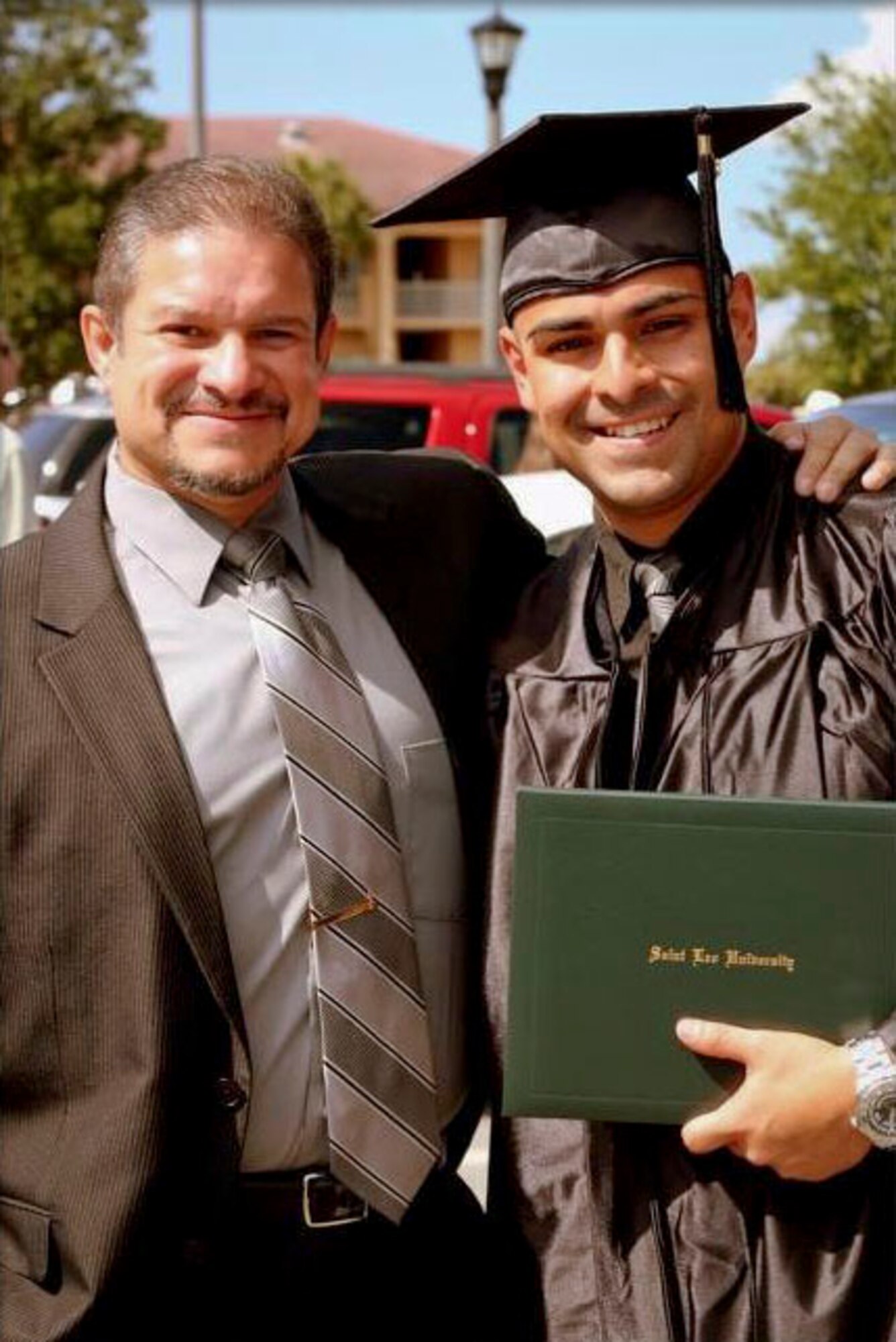 MACDILL AIR FORCE BASE, Fla. – Staff Sgt. Leonardo Velez, a personality with the 927th Air Refueling Wing, used the military to help him pay for his bachelor’s degree.  To his left stands Frank Hernandez, Jr., a retired master sergeant in the Air Force and Velez’s longtime mentor.  Velez is currently pursuing his master’s degree and a commission in the Army.  (Photo courtesy of Staff Sgt. Leonardo Velez) 