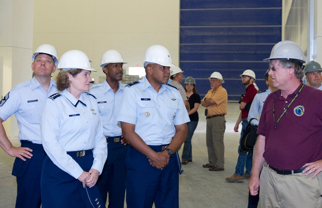 Lt. Gen. Susan Helms, commander, 14th Air Force and Brig. Gen. Anthony Cotton,
commander, 45th Space Wing, are briefed Monday at the Eastern Processing Facility on Cape Canaveral Air Force Station by Mr. Keith Dugger, right, Chief Launch Support Division. Also pictured are Command Chief Master Sgt. Dennis Vannorsdall,
14th AF Command Chief (behind General Helms) and Command Chief Master Sgt. Herman Moyer, 45th SW Command Chief. (Photo by Matthew Jurgens)