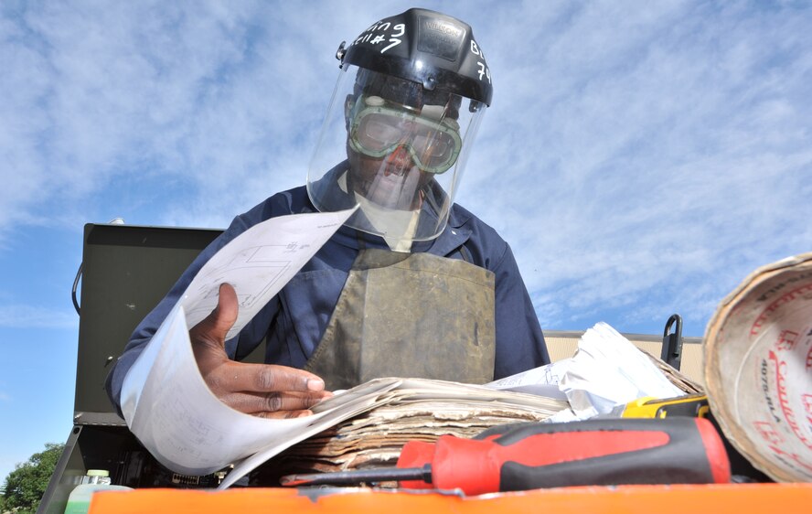 MINOT AIR FORCE BASE, N.D. -- Airman 1st Class Michael Edwards, 5th Maintenance Squadron Aerospace Ground Equipment, reads a schematic to prepare work on a refueling station here June 13. Team Minot's AGE works hard to ensure the 5th Bomb Wing is always ready through proven and efficient new maintenance processes, processes which have been benchmarked for use by many other bases. (U.S. Air Force Photo/Airman 1st Class Andrew Crawford)