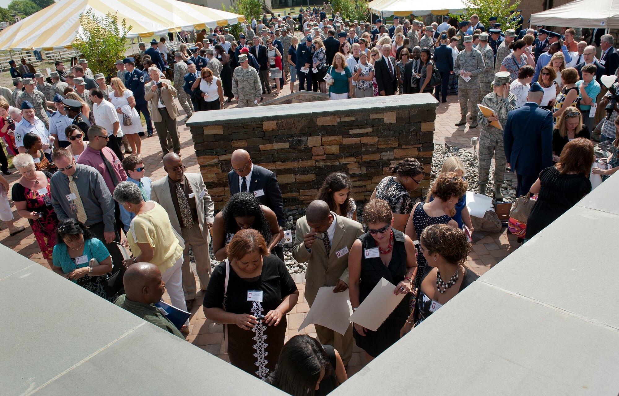 Family and friends of the nine Air Force air advisors who were killed in Afghanistan in 2011, gather at the Air Advisor Memorial at Joint Base McGuire-Dix-Lakehurst, N.J., July 27, 2012. The memorial was built through donations and volunteer labor. (U.S. Air Force photo/Senior Airman Andrew Lee)
