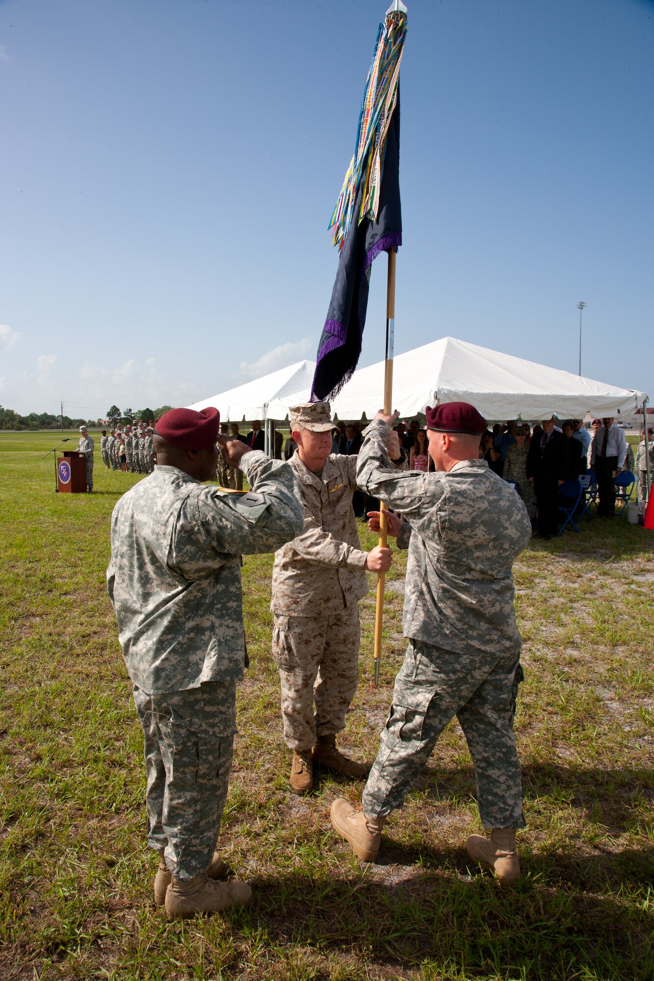 Incoming commander, U.S. Army Col.  Kirby E. Watson, accepts the Joint Communications Support Element colors from outgoing commander U.S. Marine Corps Col. Stephen P. Corcoran  and assumes command of JCSE at MacDill Air Force Base, Tampa, Fla. (Photo by Mr. Rick Maupin, JCSE)