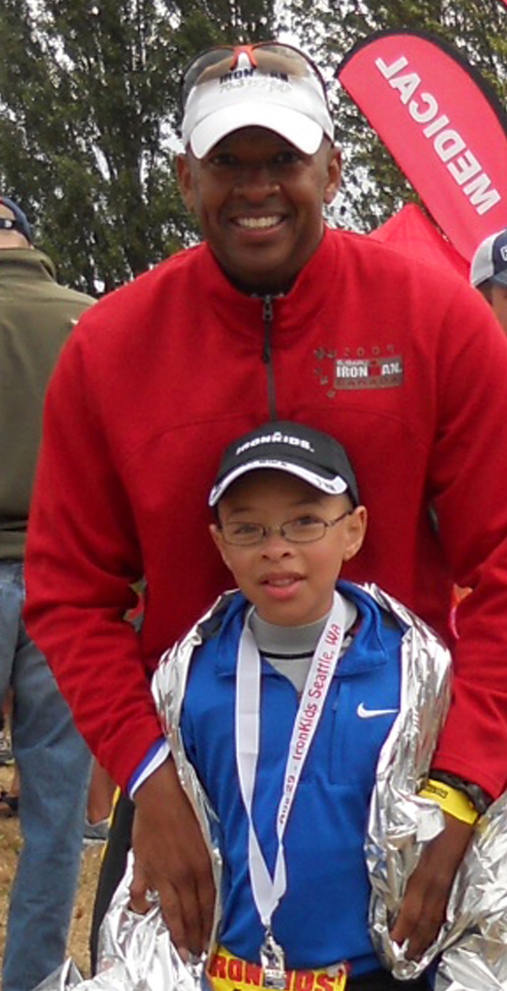 Senior Master Sgt. Derek Bryant, 728th Airlift Squadron senior loadmaster, and his son, Colby after he finished an ironman competition for military members' children. The junior Bryant placed first in his age group. Derek, who's stationed at McChord Field, Wash., has been training for and competing in extreme fitness events, such as ironman competitions and triathlons, for the last three years. The Gig Harbor resident's goal for 2012 is to compete in at least three marathons by the end of the year. (U.S. Air Force photo/2nd. Lt. Denise Hauser) 