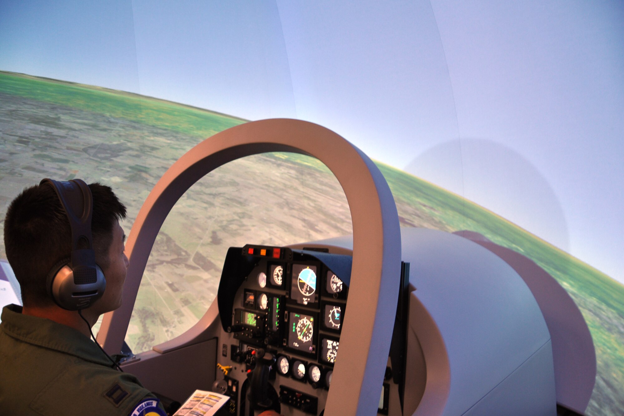 A student pilot enrolled in Undergraduate Remotely Piloted Aircraft Training at the 558th Flying Training Squadron, Joint Base San Antonio-Randolph, Texas, takes off in a new T-6 Texan II simulator July 10. The 558 FTS purchased 10 new simulators for $3 million, which saved the squadron millions of dollar when compared to a traditional T-6 simulator, which cost $3 million each. EDITOR'S NOTE: The student pilot's name was withheld due to security concerns. (U.S. Air Force photo/Staff Sgt. Clinton Atkins)