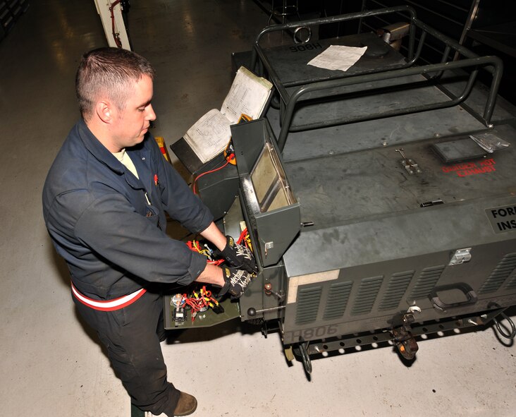 MINOT AIR FORCE BASE, N.D. -- Staff Sgt. Stephen Jech, 5th Maintenance Squadron aerospace ground equipment, troubleshoots a control panel here June 13. Team Minot's AGE works hard to ensure the 5th Bomb Wing is always ready through proven and efficient new maintenance processes, processes which have been benchmarked for use by many other bases. (U.S. Air Force Photo/Airman 1st Class Andrew Crawford)
