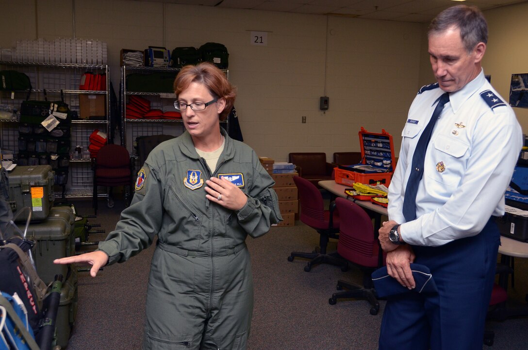 WRIGHT-PATTERSON AIR FORCE BASE, Ohio – Tech. Sgt. Tamella Hill, 445th Aeromedical Evacuation Squadron AE technician, shows Maj. Gen. Craig Neil Gourley, Vice Commander, Air Force Reserve Command, Robins Air Force Base, Ga., AES equipment during the general’s visit to the 445th Airlift Wing July 18. (U.S. Air Force photo/Staff Sgt. Mikhail Berlin)