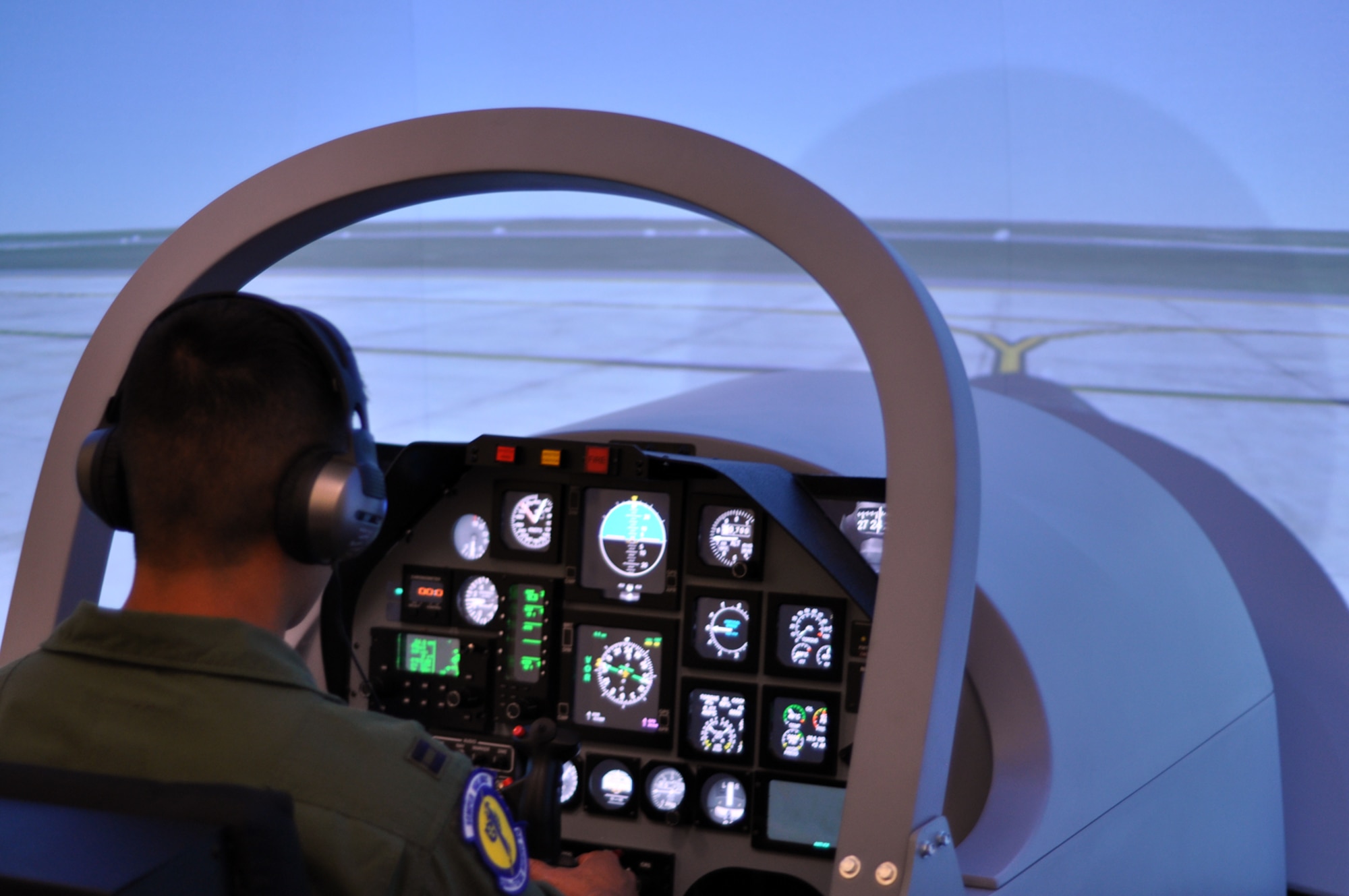 A student pilot enrolled in Undergraduate Remotely Piloted Aircraft Training at the 558th Flying Training Squadron, Joint Base San Antonio-Randolph, Texas, prepare to taxi prior to takeoff in a new T-6 Texan II simulator July 10. The new setup has dramatically increased the ability to train RPA pilots, and the ingenuity behind the new simulator saves the Air Force millions of dollars. EDITOR'S NOTE: The name were for security concerns. (U.S. Air Force photo/Staff Sgt. Clinton Atkins)