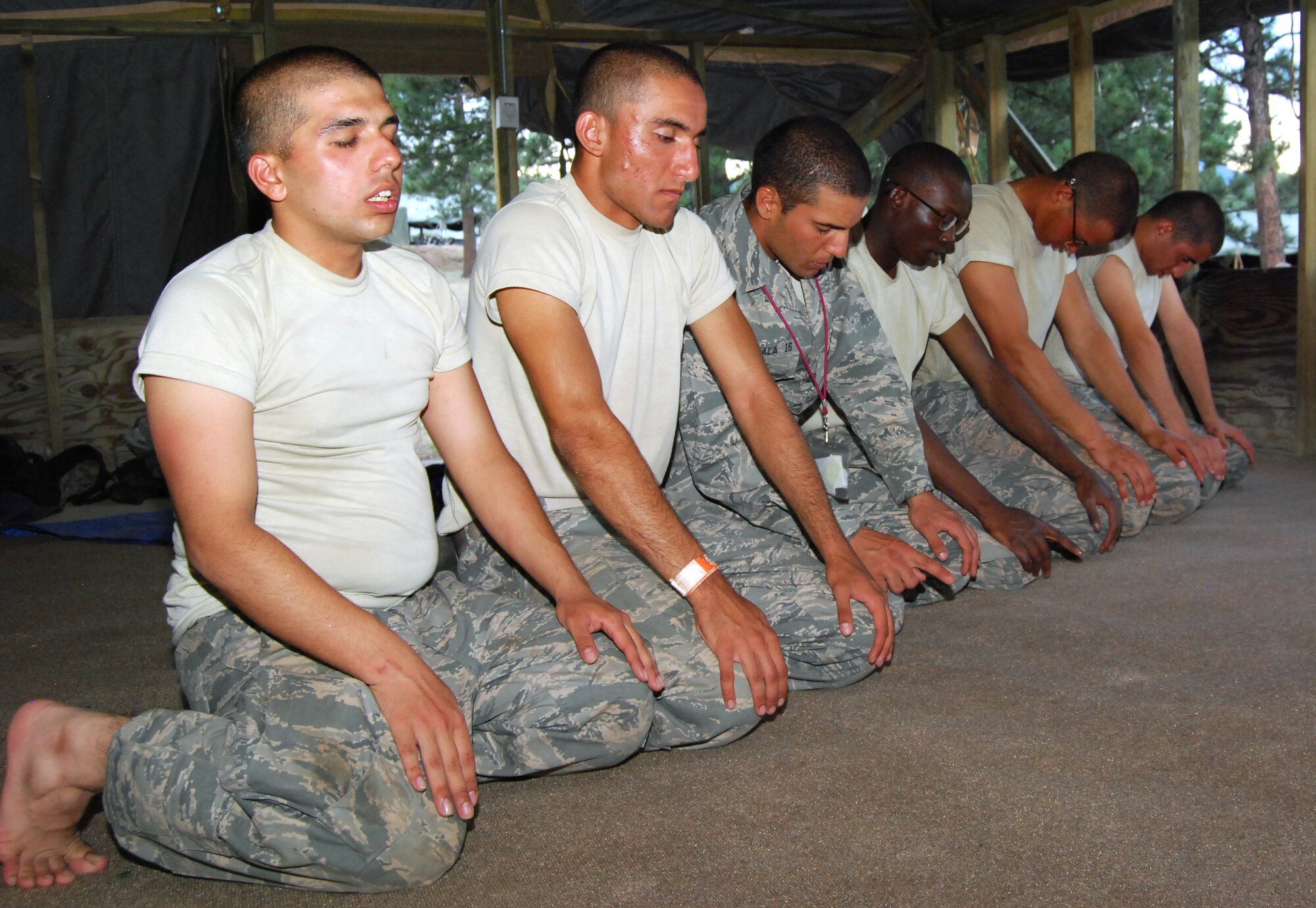 Basic cadets kneel during maghrib, or sunset prayers, in Jacks Valley's Muslim chapel July 22, 2012. Islam typically requires five daily prayers, to be done before sunrise, at noon, in the mid-afternoon, just after sunset and before going to bed for the evening. (U.S. Air Force photo/Don Branum)