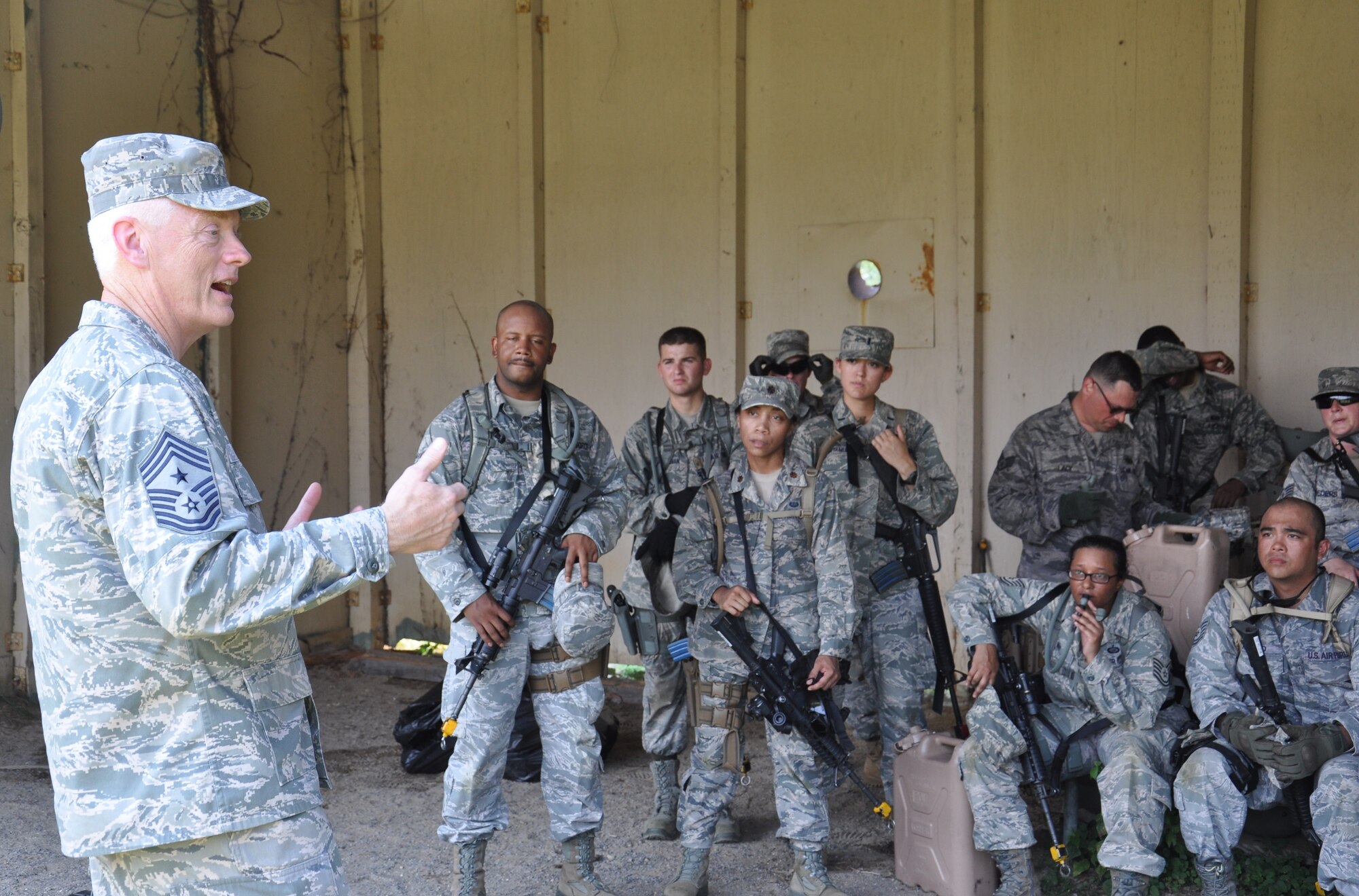 Chief Master Sgt. Richard Kaiser, command chief for Air Mobility Command, talks with Airmen going through Combat Airmen Skills Training in preparation for upcoming deployments during his visit with the U.S. Air Force Expeditionary Center, July 18. Kaiser spoke about the importance of the training being offered and how it has been used in real world situations to save lives in combat. Kaiser visited each of the Air Force units on the installation during his visit here. (U.S. Air Force photo by 1st Lt. Sybil Taunton/Released)