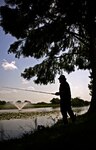 Benjamin Bruderer, Air Force Personnel Operations Agency
contractor, fishes for black bass in one of the stock ponds at
Joint Base San Antonio-Randolph July 16.
(U.S. Air Force photo by Benjamin Faske)