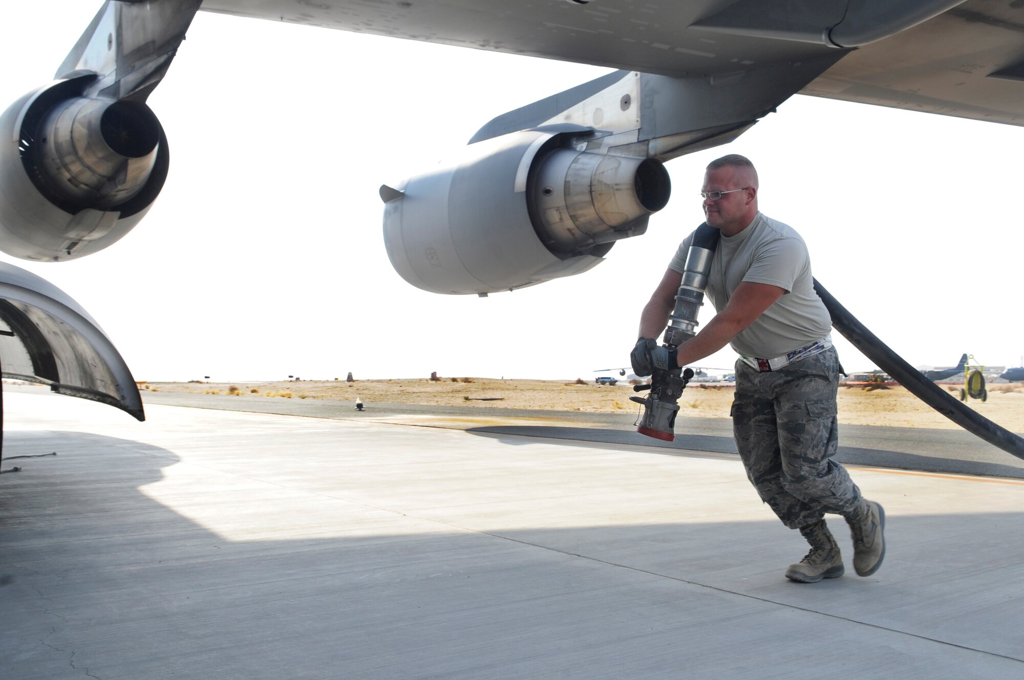 SOUTHWEST ASIA - Airman 1st Class Michael Thompson, 386th Expeditionary Logistics Squadron fuels equipment operator, prepares to refuel a C-17 Globemaster III here July 24. The Airmen of petroleum, oil and lubricants shop provide a service which is vital to the base's mission success. From providing fuel for the C-17, to filling gas tanks of the helicopters, POL Airmen do it all. Thompson is the 386th Air Expeditionary Wing's Rock Solid Warrior this week. (U.S. Air Force photo/Staff Sgt. Alexandra M. Boutte)