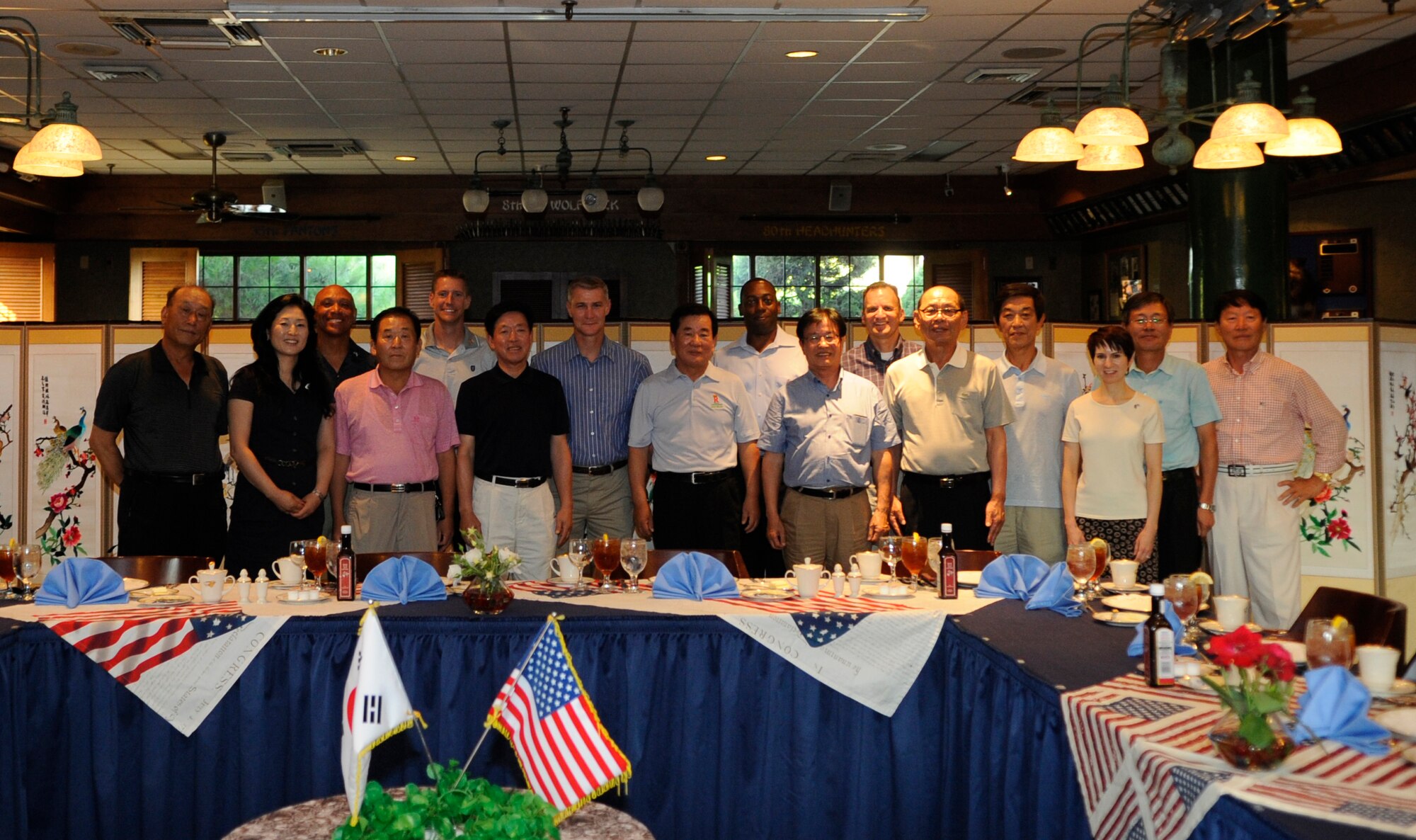 Members of the Korean-American Gunsan Association pose for a group photo July 26, 2012, at Kunsan Air Base, Republic of Korea. For more than 40 years, the KAGA has been a way for base leadership and local businessmen to maintain a positive relationship. (U.S. Air Force photo/Senior Airman Brigitte N. Brantley)