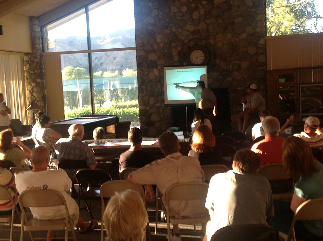 Chadi Wahby, a civil engineer for the U.S. Army Corps of Engineers Los Angeles District, talks to residents of Green River, a 500-plus home residential community along the Santa Ana River, about the progress of the flood risk reduction project under construction adjacent to their development during a July 25 meeting. 