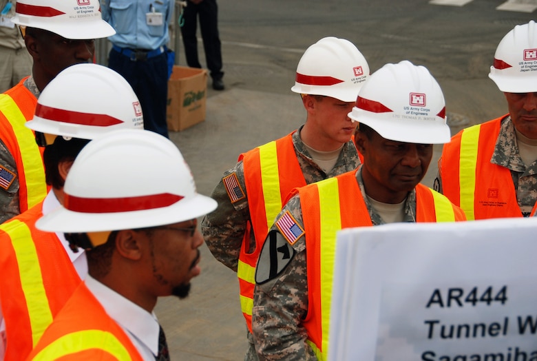 JAPAN — Lt. Gen. Thomas P. Bostick, commanding general of the U.S. Army Corps of Engineers (right), receives a briefing from Cedric Bazemore, the Kanagawa resident engineer, during his visit to the USACE Japan Engineer District July 20, 2012.