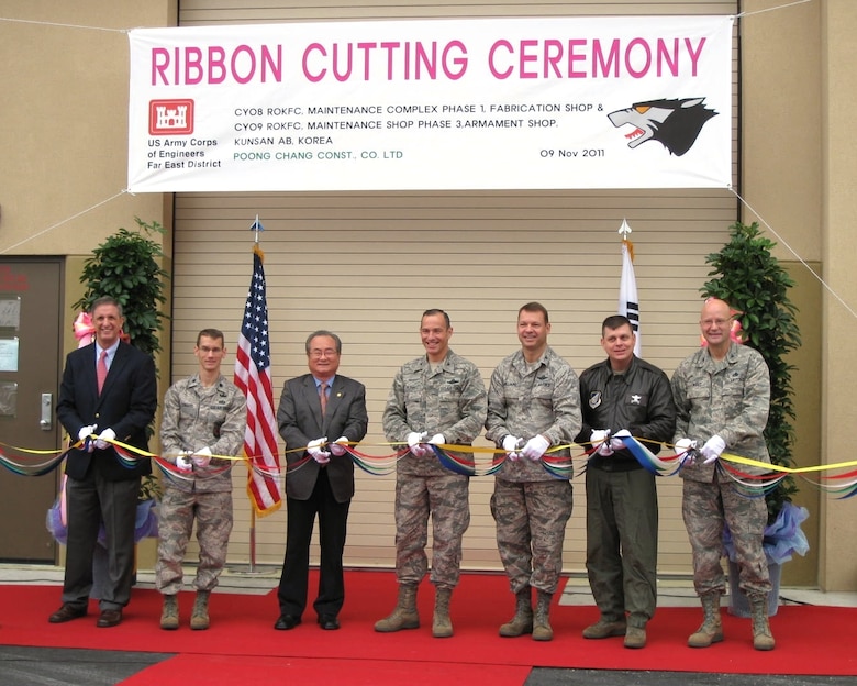 The U.S. Army Corps of Engineers, Far East District and members of the U.S. Air Force 8th Fighter Wing "Wolf Pack" cut the ribbon on two phases of a new maintenance complex at Kunsan Air Base Nov. 9. Sam Adkins (left), Chief of Construction Division, represented FED at the ceremony. (U.S. Air Force Photo)