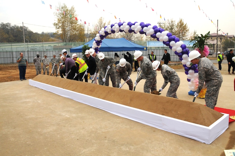 Members of the U.S. Army Corps of Engineers, Far East District, along with representatives from the 65th Medical Brigade and U.S. Army Garrison Daegu break ground on the new combined health and dental clinic for Camp Carroll Nov. 3. This facility will include a troop medical clinic, preventive medicine facilities, and after hours walk-in care facilities and replace the out-dated, existing troop medical clinic and dental clinic. (Photo by Patrick Bray)