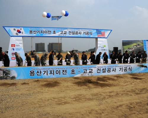 Gen. James Thurman (ninth from left), United States Forces Korea Commander, Kim, Kwan-jin (tenth from left), Korean Minister of National Defense, and other distinguished guests break ground on a new elementary and high school at U.S. Army Garrison Humphreys Sept. 2.  The U.S. Army Corps of Engineers, Far East District will construct the projects which will be the first vertical construction projects as part of the Yongsan Relocation Program and are expected to be complete by summer 2013.  (Photo by Patrick Bray)