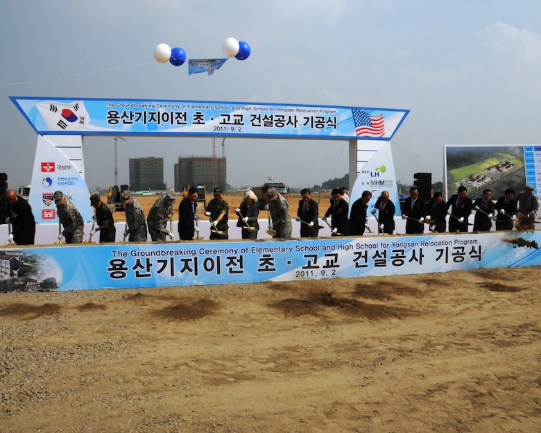 Gen. James Thurman (ninth from left), United States Forces Korea Commander, Kim, Kwan-jin (tenth from left), Korean Minister of National Defense, and other distinguished guests break ground on a new elementary and high school at U.S. Army Garrison Humphreys Sept. 2.  The U.S. Army Corps of Engineers, Far East District will construct the projects which will be the first vertical construction projects as part of the Yongsan Relocation Program and are expected to be complete by summer 2013.  (Photo by Patrick Bray)