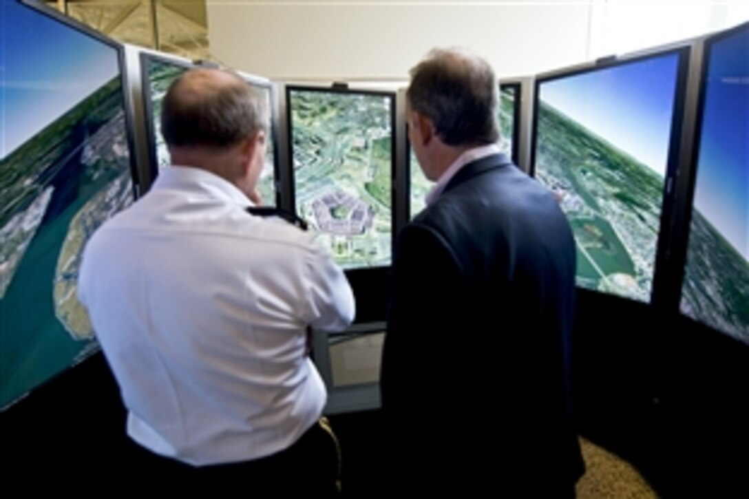 Jonathan Rosenberg, right, Google senior vIce president of product management, gives Army Gen. Martin E. Dempsey, chairman of the Joint Chiefs of Staff, a demonstration of Google Earth at Google headquarters in Mountain View, Calif., July 26, 2012.