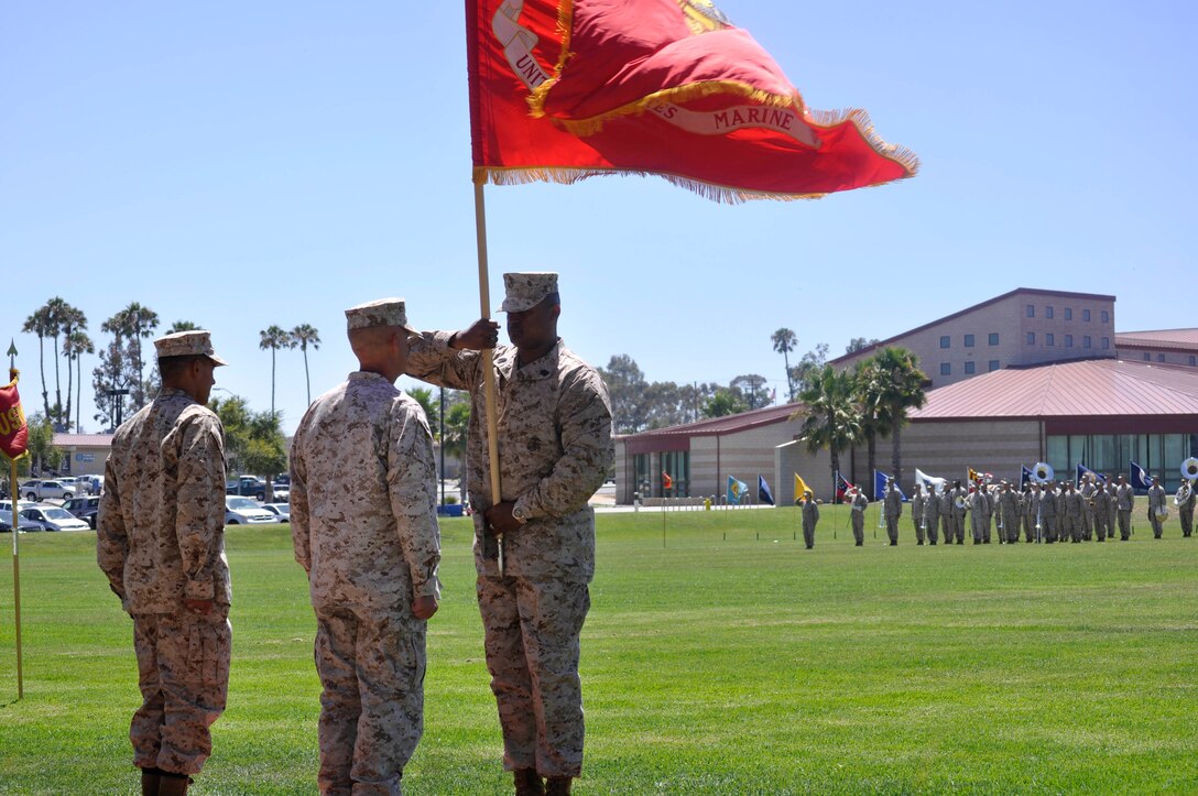 Col. James A. Hogberg, outgoing commanding officer of Headquarters and Support Battalion at Marine Corps Base Camp Pendleton, prepares to accept and give the colors to the oncoming commanding officer during a change of command ceremony, on Camp Pendleton’s 11 Area Parade Deck, July 27. Hogberg will be properly relived of his duties by Col. Michael E. Cordero, incoming commanding officer of Headquarters and Support Battalion at MCB Camp Pendleton.