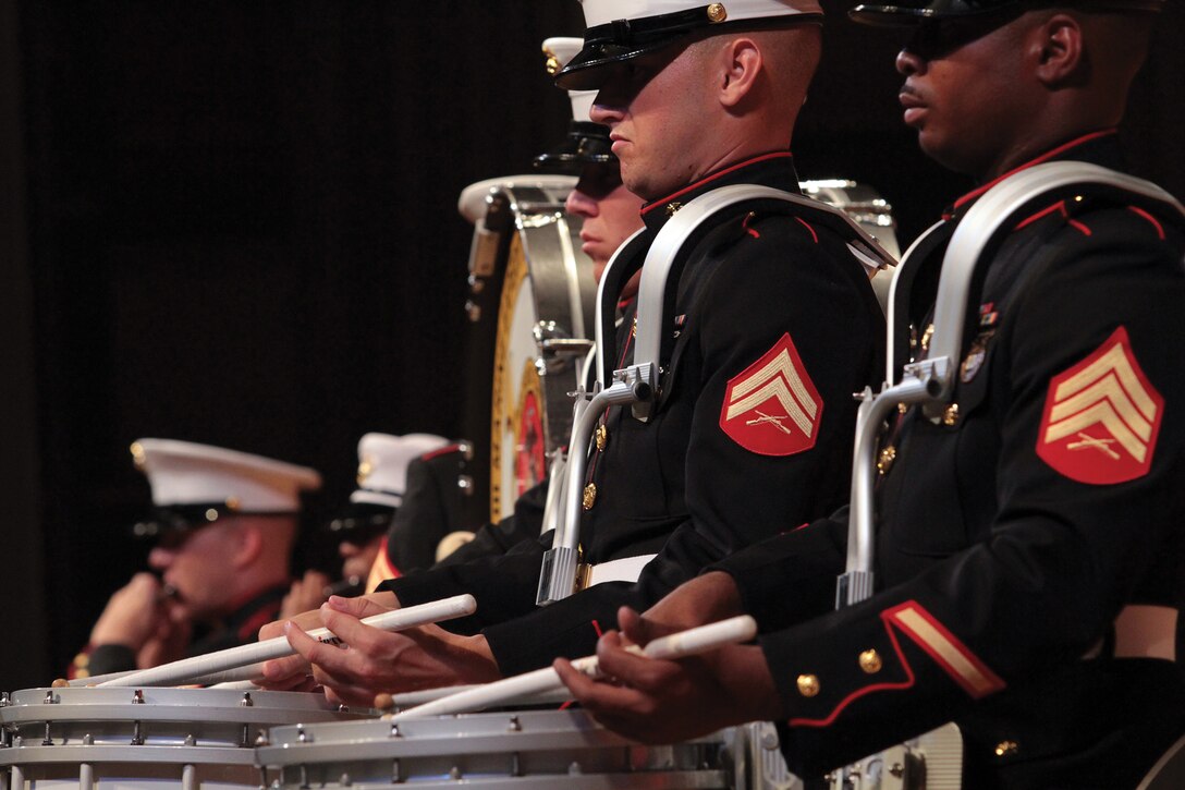 Percussionists for the III Marine Expeditionary Force Band perform during the 2012 summer concert at the Okinawa Convention Center June 9. The band played pieces to honor the victims of the Great East Japan Earthquake and subsequent tsunami and entertained the audience with a mixture of music.
