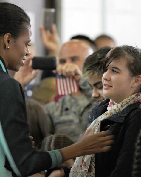 RAF MILDENHALL, England -- First lady Michelle Obama greets U.S. military families at RAF Mildenhall here July 29, 2012. Families assigned to RAF Mildenhall, RAF Lakenheath and the 501st Combat Support Wing were among the families the first lady met with prior to her departure.  Obama stopped at the base as part of the Joining Forces initiative. While in the U.K., the first lady met with approximately 1,000 British and American children as part of her Let’s Move! campaign and was also the U.S. presidential delegation for the opening ceremony of the 2012 Olympic Games. (U.S. Air Force photo/Master Sgt. Brian M. Boisvert)