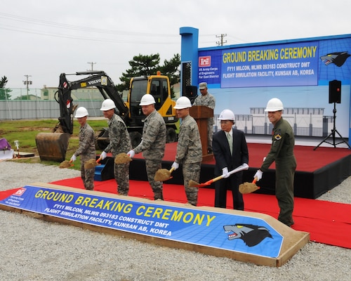 Col. Don Degidio (second from left), Commander, U.S. Army Corps of Engineers, Far East District, Gen. Gary L. North (third from left), Commander of the Pacific Air Forces, and Col. Scott L. Pleus (fourth from left), Commander of the 8th Fighter Wing, along with Air Force personnel and FED’s contractor break ground on the Distributive Mission Training Flight Simulation Facility Aug. 22 at Kunsan Air Base.  The DMT Flight Simulation Facility will allow pilots at Kunsan to train with other pilots around the world using the latest simulation technology.  (Photo by Patrick Bray)