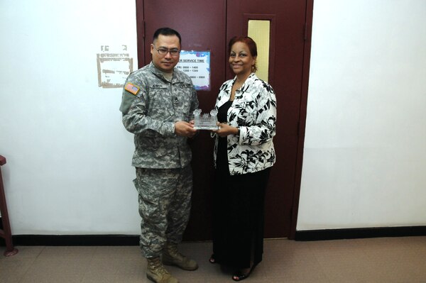 Monte Howard (right), Chief of the U.S. Army Corps of Engineers, Far East District Workforce Management, and Staff Sgt. Sung Kwon (left), Human Resources Specialist proudly pose with the Family Readiness Team Award. The award was presented by Maj. Gen. Bo Temple, USACE Deputy Commanding General, during the Summer Leader's Conference awards dinner in New Orleans Aug.1. (Photo by Patrick Bray)