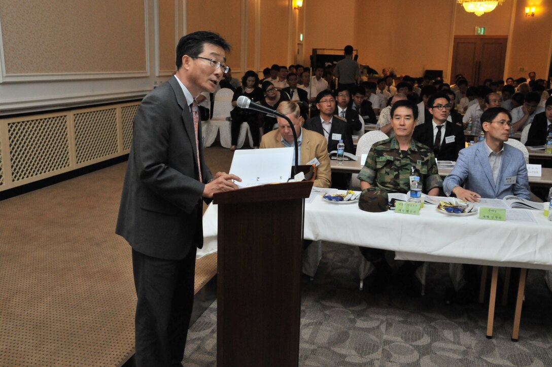 Chris Kim, Chief of the U.S. Army Corps of Engineers, Far East District Technical Review Branch, briefed attendees of the Local Construction Materials Conference on the role of USACE and FED July 27. (Photo by Patrick Bray)