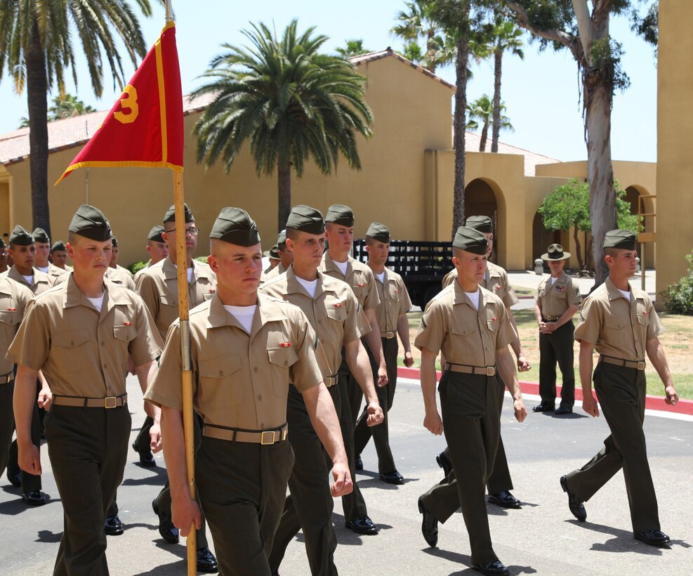 PFC Kurt Hauser leads platoon 1073 as the guide during a family day march at Marine Corps Recruit Depot San Diego, Calif. on June 21. Hauser was the company honor man for Delta Company, consisting of 266 graduating Marines.