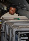 A member of Combat Shield checks computer readouts during a test of an F-16 Fighting Falcon on Kunsan Air Base (AB), Republic of Korea, July 26, 2012. Combat Shield came to Kunsan AB to test the radar threat warning and jamming systems of the F-16s. (U.S. Air Force photo/Staff Sgt. Jonathan Fowler)