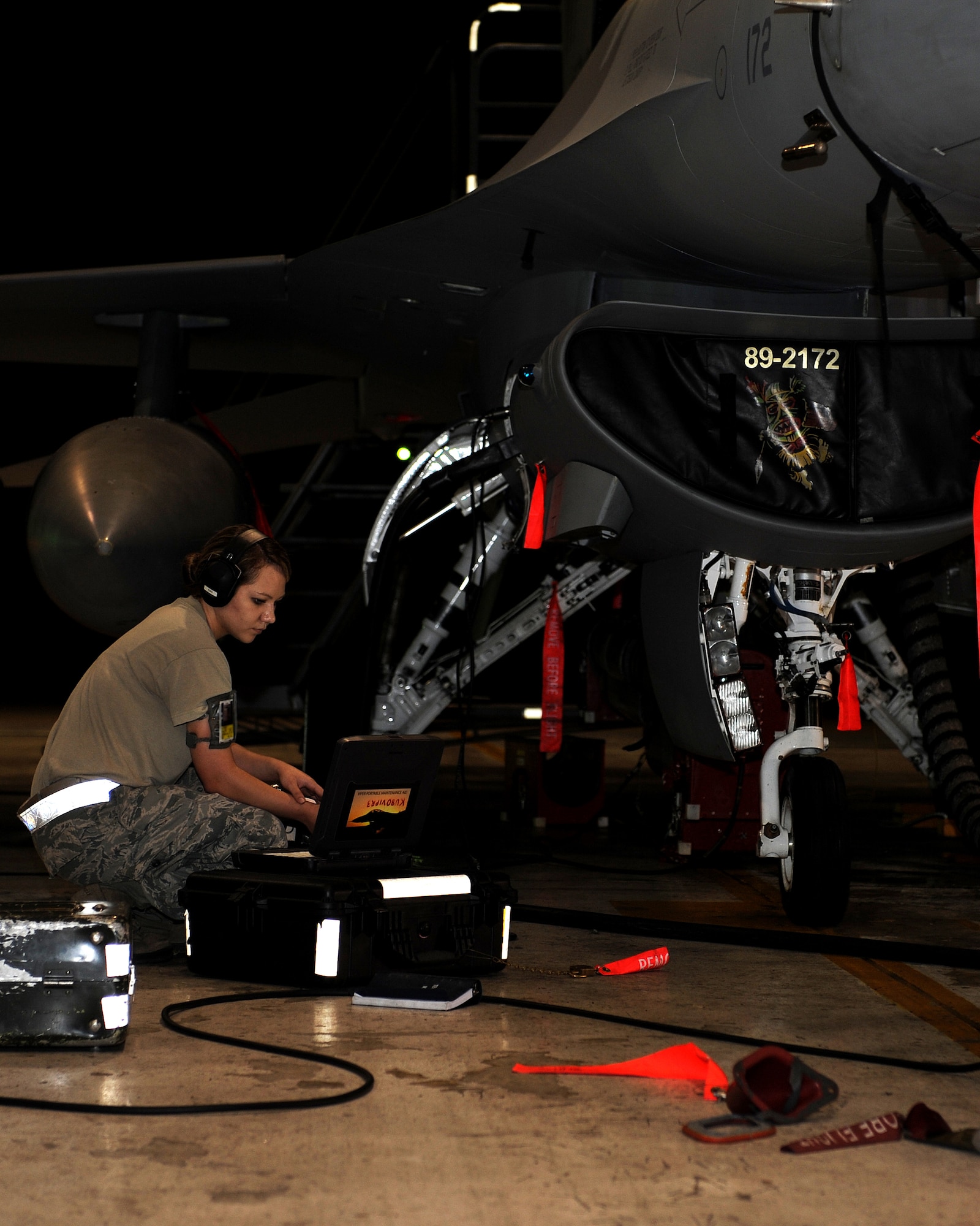 A Member of the 8th Maintenance Squadron checks computer readouts during a test on an F-16 Fighting Falcon on Kunsan Air Base, Republic of Korea. This was part of a test of the aircrafts radar threat warning and jamming systems to confirm that the aircraft was operating appropriately. (U.S. Air Force photo/Staff Sgt. Jonathan Fowler)