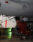 A member of the 8th Maintenance Squadron (MXS) attaches testing equipment to an F-16 Fighting Falcon on Kunsan Air Base, Republic of Korea, July 26, 2012. The equipment tests the planes radar threat warning and jamming systems to ensure they are working properly and meeting all required standards. (U.S. Air Force photo/Staff Sgt. Jonathan Fowler)