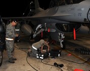 Members of Combat Shield and the 8th Aircraft Maintenance Squadron prepare to test an F-16 Fighting Falcon’s radar systems on Kunsan Air Base, Republic of Korea, July 26, 2012. The tests are designed to simulate various types of radar signals to ensure that the aircraft accurately registers and displays them to the pilot. (U.S. Air Force photo/Staff Sgt. Jonathan Fowler)