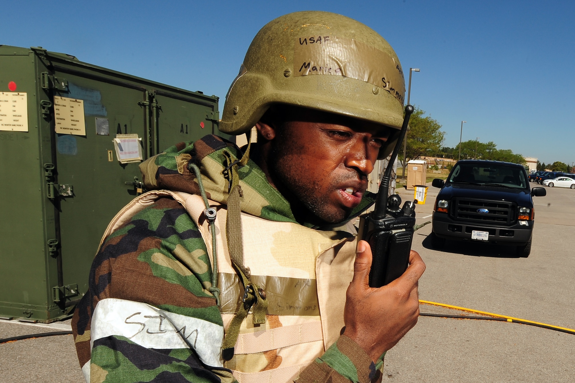 U.S. Air Force Airman 1st Class Marico Simmons, 55th Force Support Squadron, communicates with the command center following a patient transfer to the medical tent and part of an Operational Readiness Exercise held at Offutt Air Force Base, Neb., July 27.  Airmen are graded on how well they perform their duties during their training. (U.S. Air Force Photo by Josh Plueger/Released)
