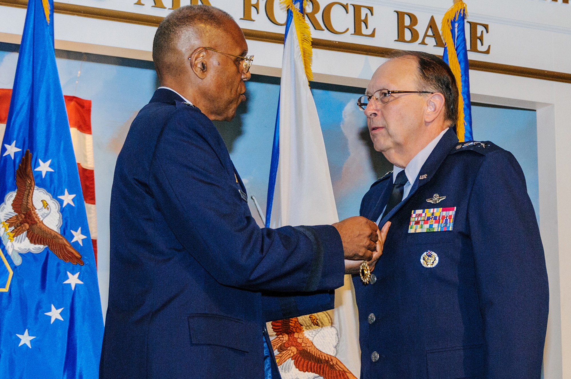 Air Force Vice Chief of Staff Gen. Larry Spencer presents the Distinguished Service Medal to Lt. Gen. Charles Stenner Jr., who retired from the Air Force with 39 years of military service. Spencer presided at the retirement in the Museum of Aviation, adjacent to Robins Air Force Base, Ga., July 30, 2012. (U.S. Air Force photo/Staff Alexy Saltekoff)