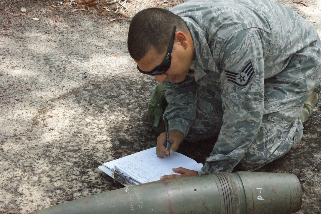 Staff Sgt. Ricardo Porto, NAVSCOLEOD student, conducts a reconnaissance training problem during Core Division training Jul. 19, 2012, at Eglin Air Force Base, Fla.  Students must pass all nine divisions of the EOD basic course before earning their "crab" . (U.S. Air Force photo/Dan Hawkins)