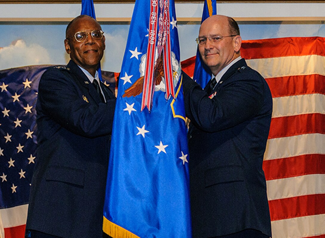 Air Force Vice Chief of Staff Gen. Larry Spencer, left, passes the Air Force Reserve Command flag to Lt. Gen. James Jackson, who accepts command of AFRC July 30, 2012. Spencer presided at the change of command and the retirement of Lt. Gen. Charles Stenner Jr. at the Museum of Aviation, adjacent to Robins Air Force Base, Ga. (U.S. Air Force photo/Staff Sgt. Alexy Saltekoff)