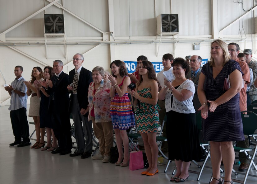 Family and friends clap after U.S. Air Force Col. Alvis Headen assumed command of the 23d Medical Group and Col. Mike Koppen was relieved during a change of command ceremony July 27, 2012, at Moody Air Force Base, Ga.  (U.S. Air Force photo by Senior Airman Eileen Meier/Released)