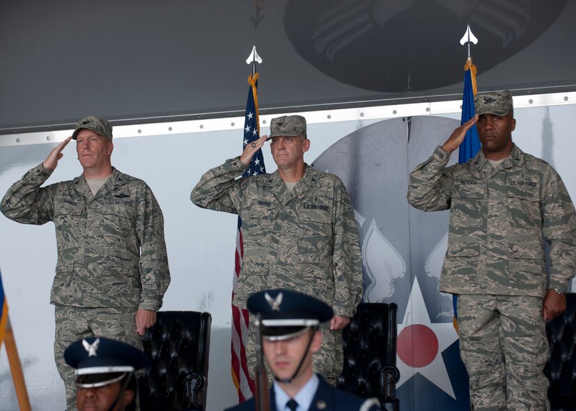U.S. Air Force Colonels Steven Ramer, 23d Wing vice commander, Mike Koppen, former 23d Medical Group commander and Alvis Headen, new 23d MDG commander render a salute during the playing of the national anthem while the Moody Honor Guard post the colors during the 23d MDG change of command ceremony July 27, 2012, at Moody Air Force Base, Ga. Headen assumed command of the 23d MDG and a retirement ceremony was held for Koppen, who retired after being relieved of command. (U.S. Air Force photo by Senior Airman Eileen Meier/Released)