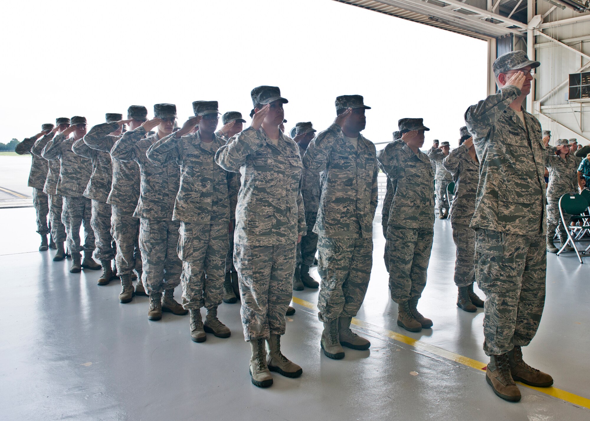 Airmen from the 23d Medical Group render the first salute to U.S. Air Force Col. Alvis Headen, 23d MDG commander, after he assumed command during the 23 MDG change of command ceremony at the fuels barn July 27, 2012, at Moody Air Force Base, Ga. Retired Col. Mark Koppen was relieved of his duties and spoke about how honored he was to lead the 23 MDG. (U.S. Air Force photo by Senior Airman Eileen Meier/Released)