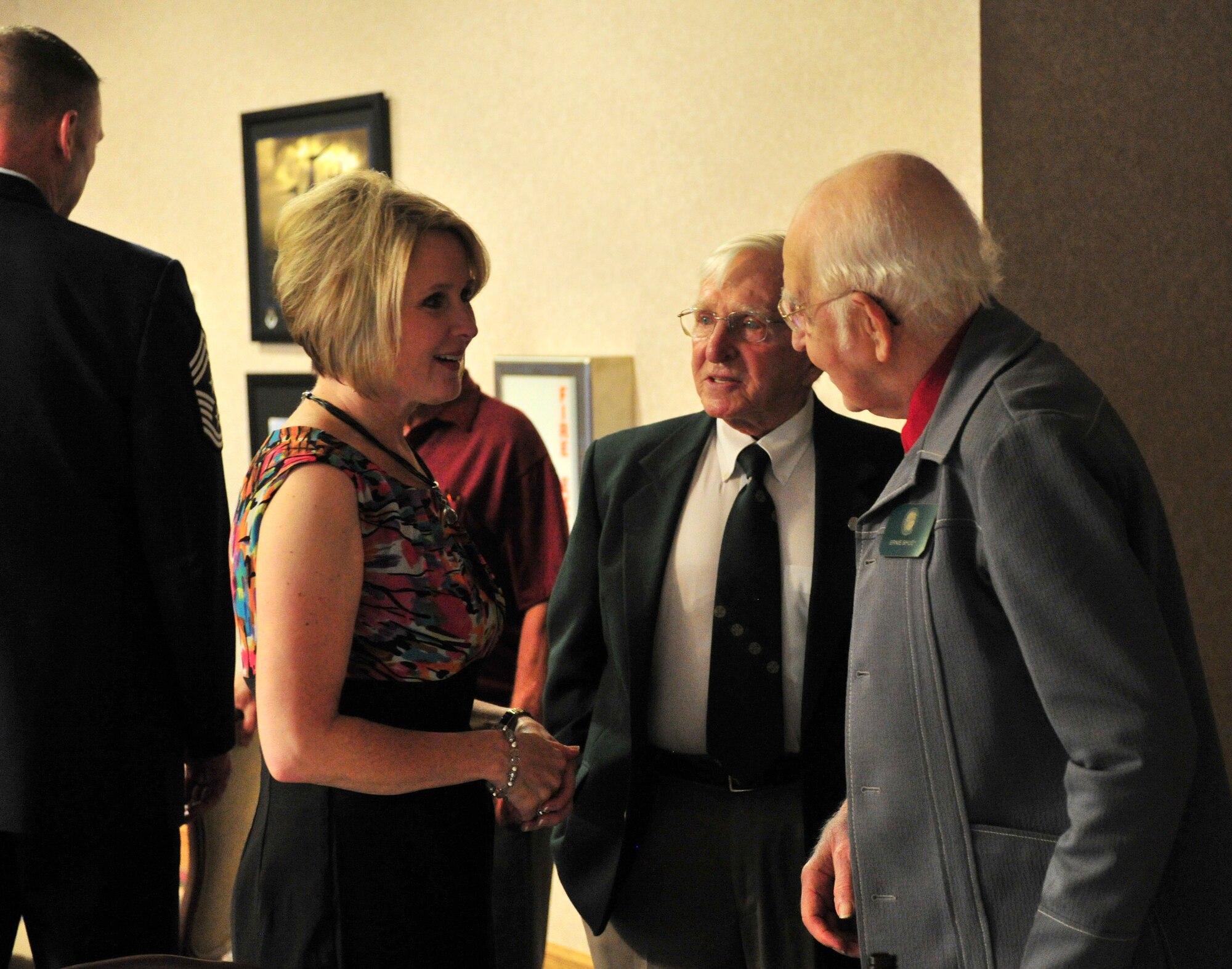 Tami Henderson, military spouse, talks with members of the Order of Daedalians at Cannon Air Force Base, N.M., July 26, 2012. The Order of Daedalians was created in 1933 for pilots who flew during World War l and has since grown to include any rated pilot who has served in the military. (U.S. Air Force photo/Airman 1st Class Xavier Lockley)
