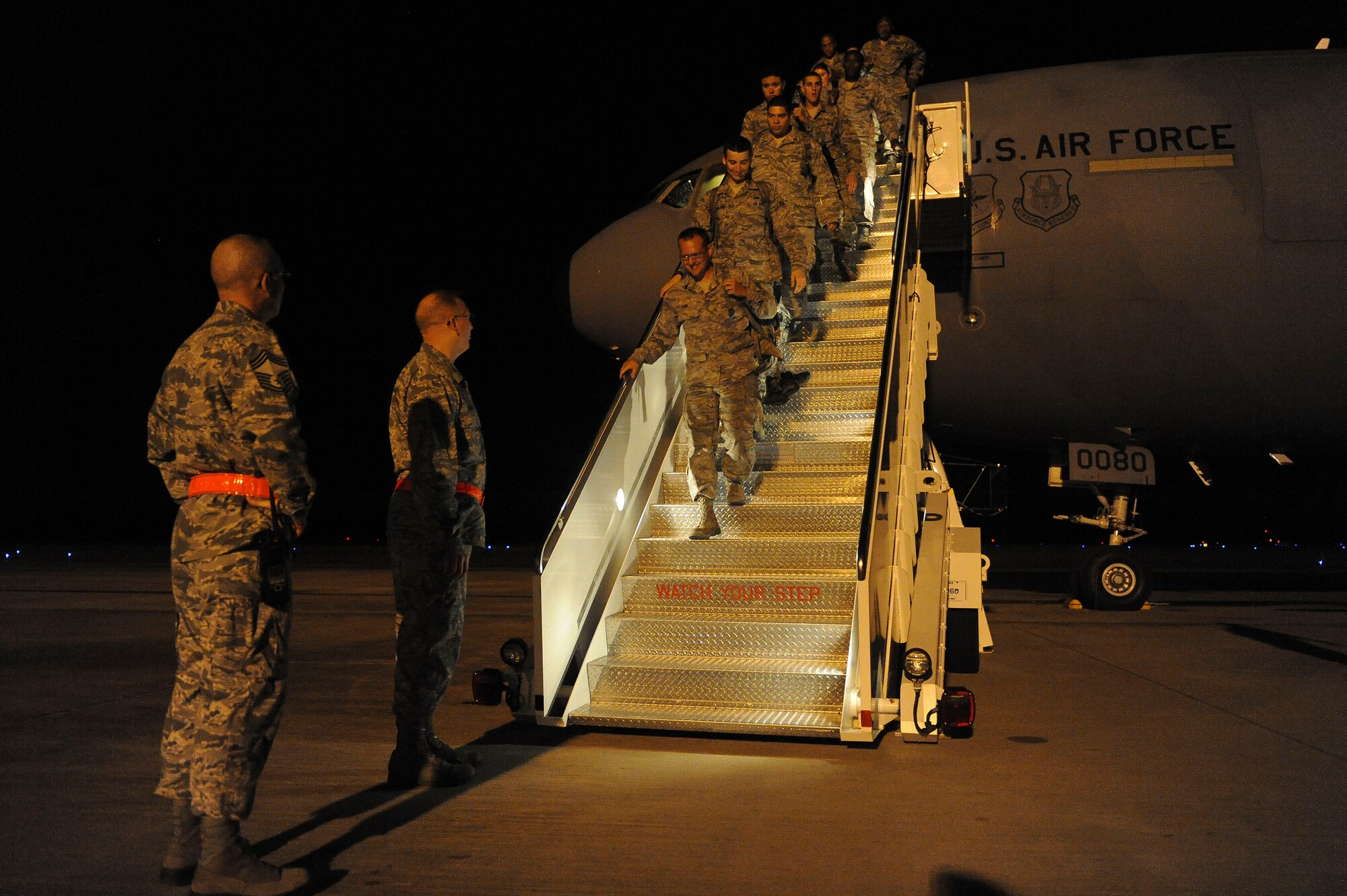 U.S. Air Force Col. Jeffrey Decker, 23d Maintenance Group commander, and Chief Master Sgt. William Medlin, 23d MXG command chief, welcome Airmen returning from Red-Flag 12-4 at Moody Air Force Base, Ga., July 28, 2012. The Airmen were part of a group of more than 150 maintainers and other supporting Airmen deployed from Moody to Nellis Air Force Base, Nev., in support of Red Flag. (U.S. Air Force photo by Staff Sgt. Ciara Wymbs/Released)
